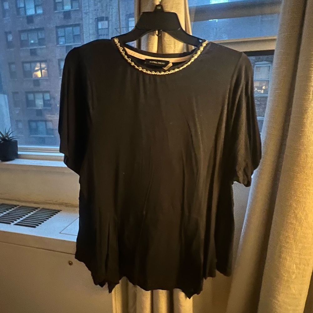 Navy peplum top with decorative neckline